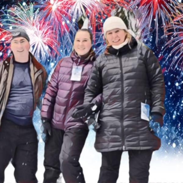 three people standing in winter clothing with fireworks behind them