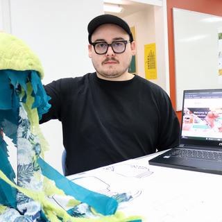 James O’Reilly holds up an jellyfish made from fabric for his Refillery display.