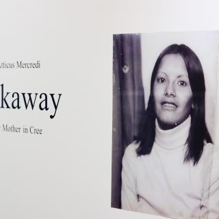 A portrait of Atticus Mercredi's mother beside the exhibit name.