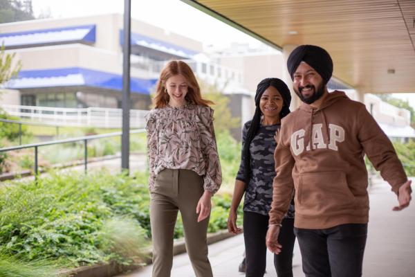 Three students walking on VIU's Nanaimo campus