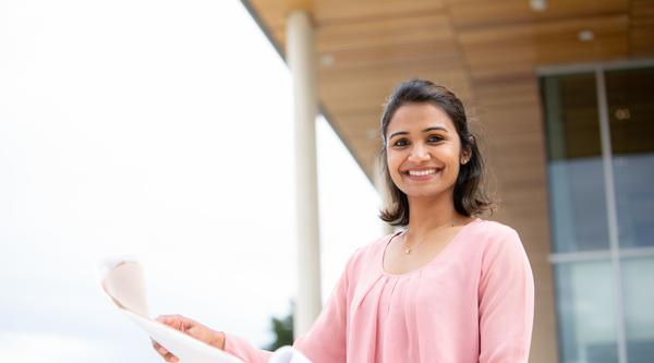 Student holding a paper