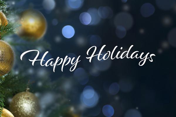 Happy holidays in text with background of ornaments on a tree