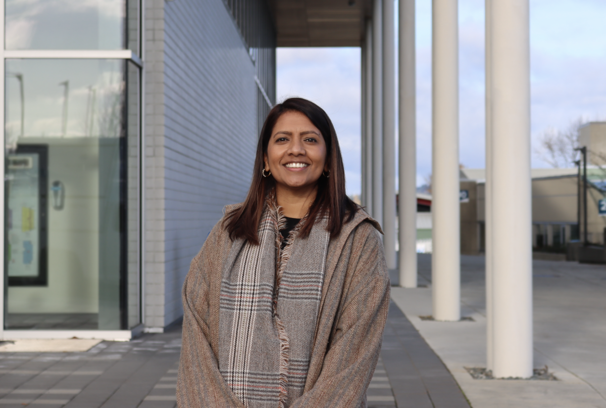 VIU Nursing professor Dr. Caroline Variath standing outside on a sunny day and smiling at the camera