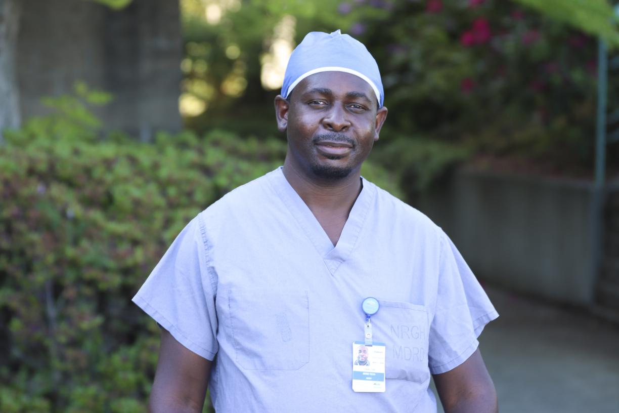 Portrait shot of Charlton Mapayi, VIU alum, in his scrubs