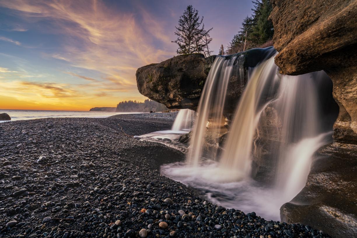 Beach scene with a waterfall