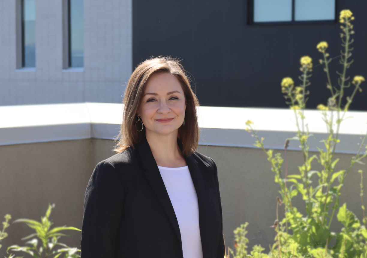 Dr. Patricia Johnston standing outside at VIU looking at camera