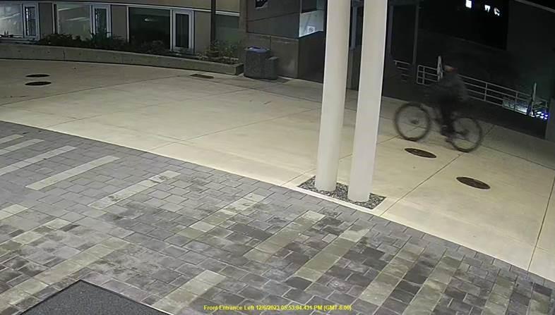 Man riding a bicycle at VIU's Nanaimo campus