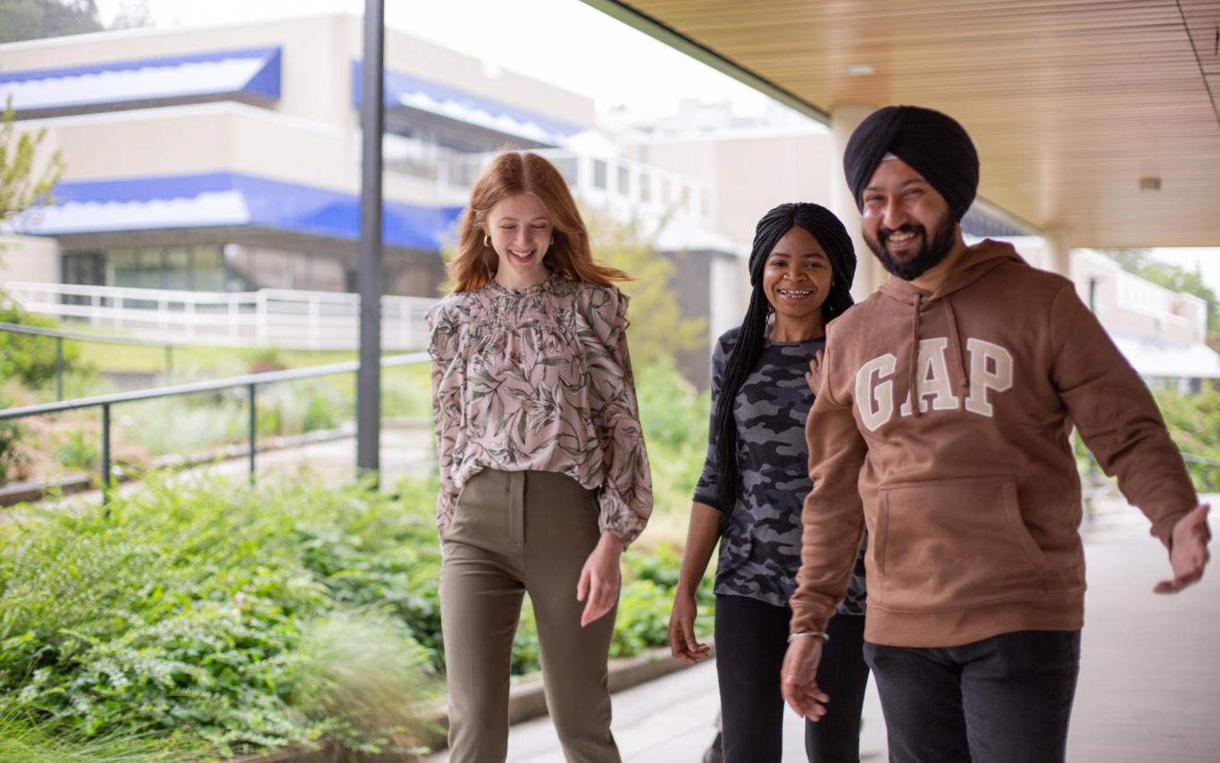 Three students walking on VIU's Nanaimo campus