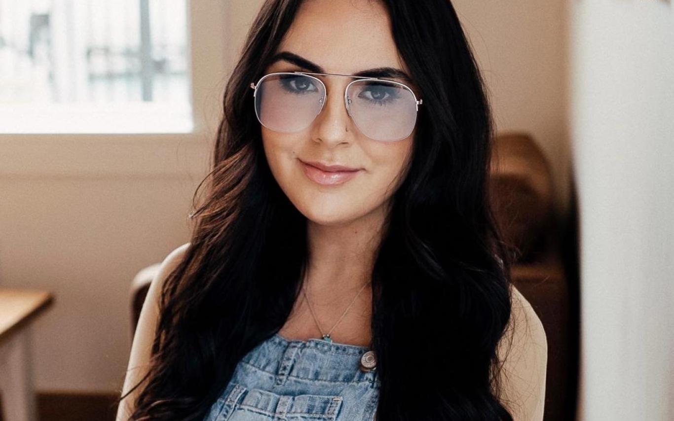 Samantha Beyond sitting and looking directly at camera